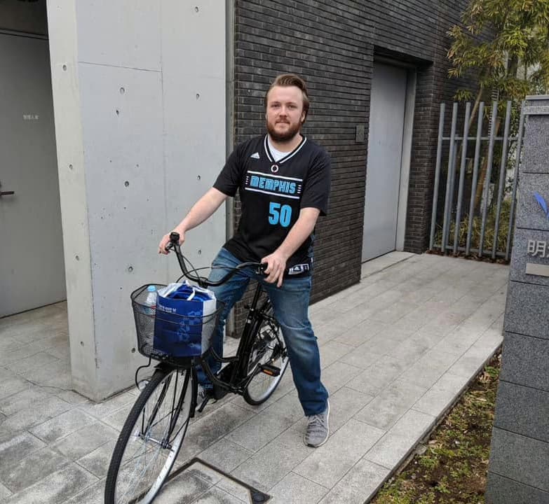 Standing with my bike outside of the bike garage